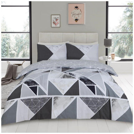 Elevate your bedroom decor with the MILA Duvet Cover Set. A sophisticated charcoal and grey color combination creates a striking look while a polycotton material ensures a luxurious soft touch. Transform your bedroom into a tranquil place of relaxation.