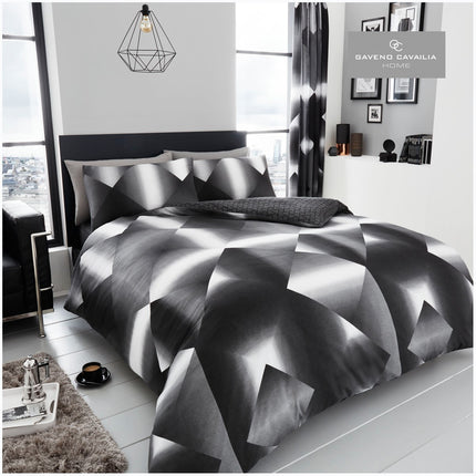 Create a modern, stunning look in your bedroom with our 3D Triangle Duvet Cover Set. Made of soft, comfortable fabric, this piece is adorned with triangle patterns and features a sleek black and white color palette. Transform any bedroom into a stylish oasis with this on-trend set.