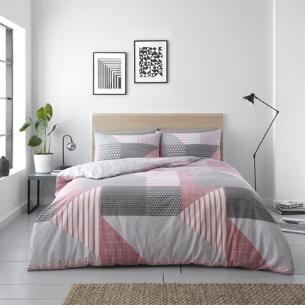 The BLAKE Duvet Cover Set features soft, blush pink polycotton fabric for a cozy, luxurious feel. The material is fade-resistant to keep its color for years to come, and the duvet cover is machine washable for easy care. Upgrade your bedroom's style and comfort with this elegant duvet cover set.