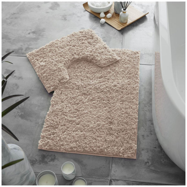 This quality bath mat set features the soft shaggy texture of a Zero Twist construction and a blush pink color to add a soft pop of color to any bathroom. The classic ribbed design is crafted from durable and spun-Polyester for an extremely soft feeling underfoot.