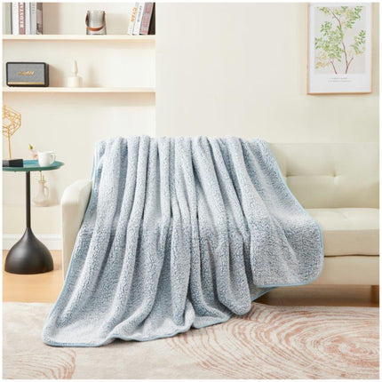 MELANGE is a luxurious blanket with ultra-soft fabric for comfort and warmth. Its hypoallergenic qualities make it an ideal choice for people with sensitive skin, providing cozy nights all winter long. Blue Color.