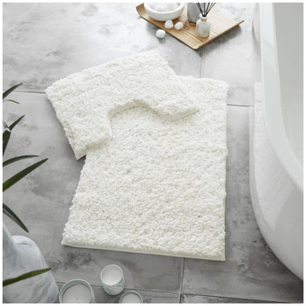 The ZERO TWIST Shaggy Bath Mat Set is the perfect addition to your home bathroom. It is crafted with an ultra-soft microfiber pile that is designed to make your bathroom experience luxurious and comfortable. The plush material absorbs water quickly and, with its tight, no-twist construction, it won’t pills or shed. This set comes in a beautiful cream color.