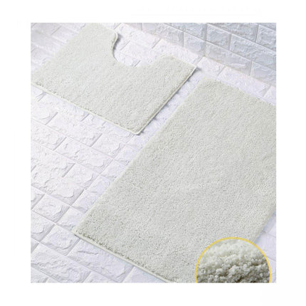 Take your bathroom to the next level with the SHINY BATH MAT SET. This ultra-plush set features a large mat for your feet and a smaller one for your toilet. Both are made from water-absorbent fabric and backed with anti-slip grip for added safety. The shimmering cream color adds a sparkle to any decor, and both mats can be washed at 30°C to maintain their shine.