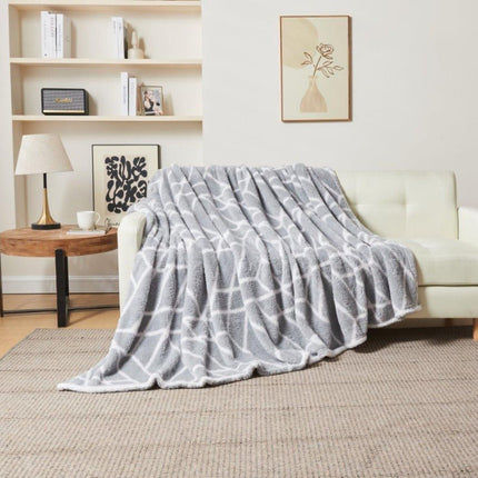 ELY GEO, a premium quality throw blanket, is designed with superior comfort in mind. Soft and cosy, it's made from colorfast, hypoallergenic fabric and can be machine washed at 30 degrees. With a beautiful charcoal grey hue, it adds a stylish touch to any home.