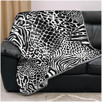 This ANIMAL SKIN Throw features faux fur that is warm, hypoallergenic, and colorfast. The leopard grey color is a perfect accent in any space. Enjoy the luxe look of animal skin without any of the drawbacks.