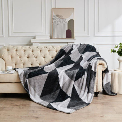 LICH FIELD provides luxurious comfort with its breathable throw. Warm and stylish, it is perfect for many uses, from a bedspread to a blanket for a sofa or bed to a settee throw. It is available in a muted charcoal/grey color.