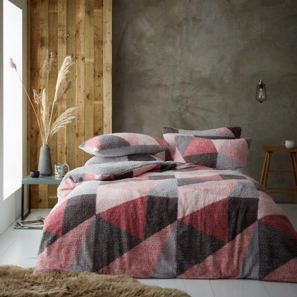 The LICHFIELD Duvet Cover Set combines blush pink and grey colors to provide a beautiful and calming atmosphere to your bedroom. Crafted from fine polyester, this duvet cover set is soft to the touch and breathable. Enjoy a good night's sleep with the perfect blend of comfort and style.