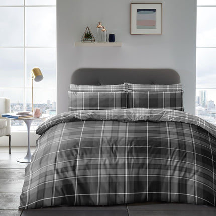 Experience refined contemporary elegance with this MURPHY CHECK Duvet Cover Set. Crafted from soft woven fabric, this timeless grey set is perfect for setting a serene and sophisticated ambiance in your bedroom. 