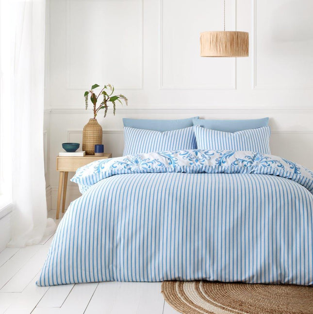 The MARGAUX pillow provides a hypoallergenic and breathable sleep experience. It features a reversible design with stylish, printed side stripes in a soothing blue color. Feel well-rested and comfortable with this high-quality pillow.