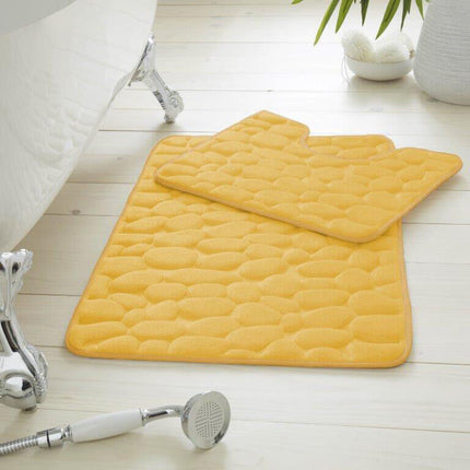 This PEBBLE BATH MAT is perfect for any bathroom setting. Its water-absorbent and ultra-soft memory foam design keeps the surface dry and comfortable, while the anti-slip cube pattern provides maximum safety. Its ochre color brings a beautiful touch of warmth.