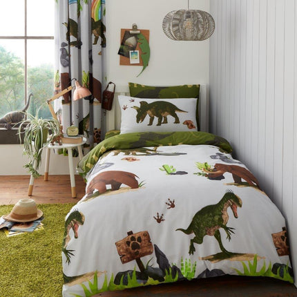 Discover this PREHISTORIC DINO Duvet Cover Set, crafted in soft, breathable cotton Blend. Its beautiful grey color with stylized illustrations of dinosaurs make it perfect for your bedroom. Crafted to last and easy to care for, it is an ideal choice for any dinosaur fan.