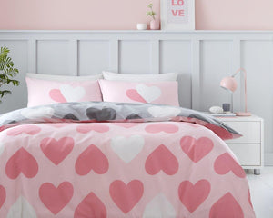 This duvet set features a charming pattern of pretty hearts on the front side, adding a touch of whimsy to any bedroom decor. The soft pink color adds a delicate and feminine touch. Rest and relax in style with this beautiful duvet set.