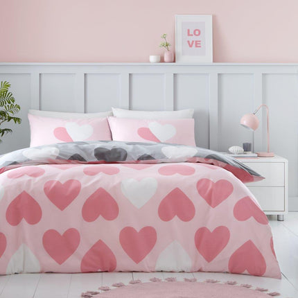 This duvet set features a charming pattern of pretty hearts on the front side, adding a touch of whimsy to any bedroom decor. The soft pink color adds a delicate and feminine touch. Rest and relax in style with this beautiful duvet set.