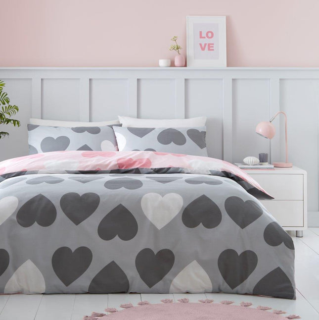 Expertly crafted with a chic reversible charcoal color and pretty hearts pattern, our PRETTY HEARTS duvet set adds a touch of elegance to any bedroom. Made with high-quality materials, this set provides both style and comfort to your sleeping space. Elevate your bedding game with a touch of sophistication.