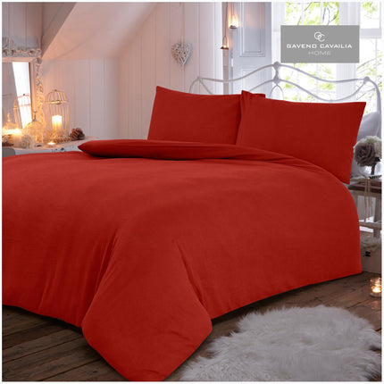 The FLANNEL PLAIN Duvet Cover Set features a soft and cozy 100 brushed cotton fabric with a classic red hue. This reversible set includes a duvet cover and pillowcase, providing comfort and style for your bedroom. The breathable fabric will keep you warm and comfortable all year long.