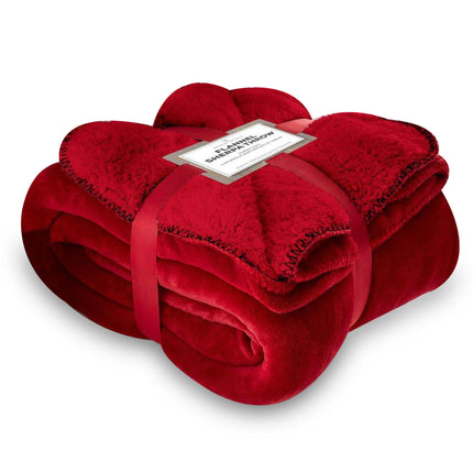 This Sherpa Throw is made with ultra-soft flannel material, providing optimal warmth and cozy comfort. The versatile throw features a red design and is perfect for layering on your bed or couch. It is also ideal for keeping you warm during movie nights.