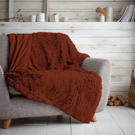 HUGG & SNUG is a warm and cosy blanket perfect for cuddling up with. Made of soft, colorfast, hypoallergenic material, it's sure to keep you snuggled up all winter long. Its rust color brings a unique and elegant aesthetic to any space.