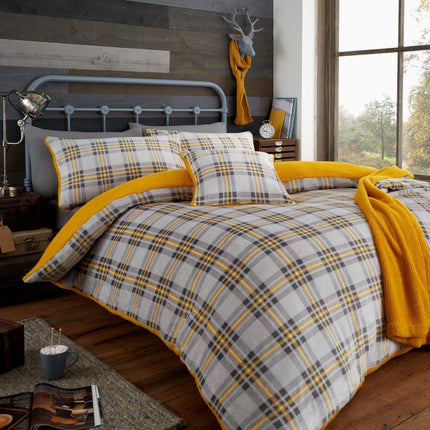 Add a touch of style to your bedroom with the HIGHLAND CHECK Duvet Cover Set. It features a classic teddy check print in a modern grey and ochre color scheme, making it the perfect choice for a sophisticated space.