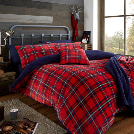 The HIGHLAND CHECK Duvet Cover Set is the perfect choice for adding a touch of class to any bedroom. Crafted from soft, 100% polyester, this set features a bold red and navy teddy check pattern. Enjoy comfort and style with this timeless design.