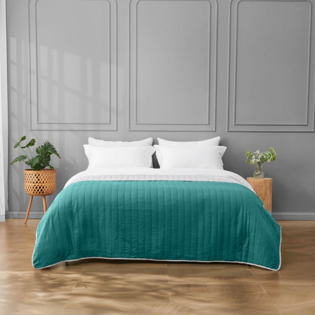 Introducing the REVERSIBLE BEDSPREAD, which features an exquisite Pinsonic Blanket with elegant design and vibrant colors. It will effortlessly complement your modern home decor, making it a stylish addition to your living room, bedroom, or guest rooms. Available in a teal/grey color.