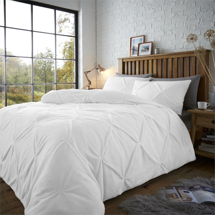 The CHISWICK PINTUCK duvet cover set is made with luxurious teddy chiswick fabric for a soft, luxurious touch. This classic style features crisp pintuck detailing for a stylish look and is available in a crisp white color. Add a touch of elegance to your bedroom.