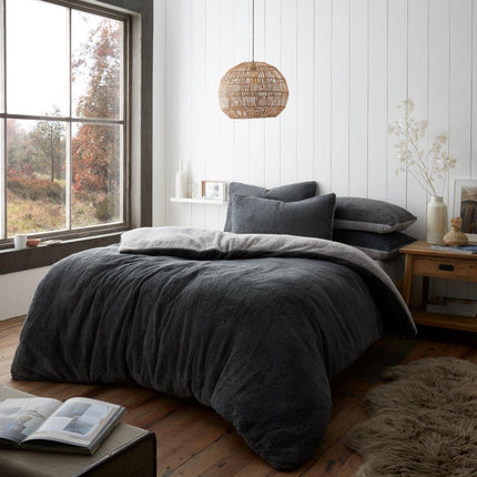 This REVERSIBLE Teddy Duvet Cover Set features a charcoal and grey reversible design for a timeless look. Crafted with premium Polyester, it is luxuriously soft, light, and breathable for a comfortable sleep. It is also durable ensuring you a restful sleep night after night.