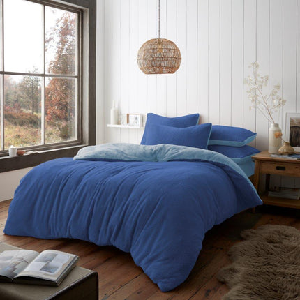 This REVERSIBLE duvet cover set is luxuriously crafted with premium polyester for a soft, breathable and comfortable sleep. Featuring a reversible design in a classic blue and light blue color, this set provides a timeless look for your bedroom. Easy to care for and machine washable.