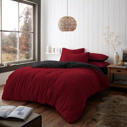 The REVERSIBLE Teddy Duvet Cover Set offers an innovative design with its reversible color palette. Crafted from luxuriously soft, plush fabric, its deep red and charcoal hues bring elegance to any bedroom. Enjoy a peaceful sleep in style and comfort.