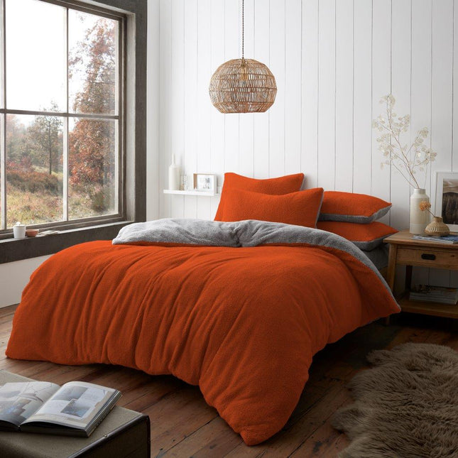 Our REVERSIBLE Teddy Duvet Cover Set features a beautiful vibrant rust color that reverses to a charcoal color, adding dimension and style to your bedroom. Its 100% Polyester design ensures a soft touch and durability. Give your bedroom a modern update with this beautiful duvet cover set.