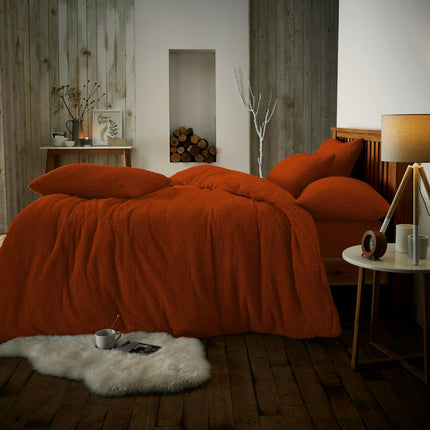 This PLAIN teddy duvet cover set is the perfect way to add warmth and comfort to your bedroom. Crafted from 100% polyester, the set features a burnt orange color and comes with two matching pillowcase. Give your bedroom a cozy and inviting feel with this duvet cover set.