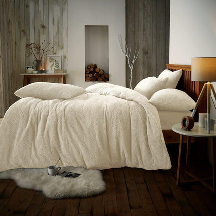 The PLAIN Teddy Duvet Cover Set is made with smooth and cozy polyester. The cream color will add a soft, neutral touch to any bedroom setting. The set includes duvet cover and matching pillowcases. Get a good night's sleep in style and comfort with PLAIN.