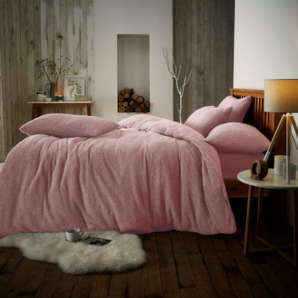 This PLAIN Teddy Duvet Cover Set is made of luxurious fabric with a smooth and cozy feel. It comes in an elegant and stylish Pink Color, perfect for creating a tranquil and inviting atmosphere in any bedroom. The set includes a duvet cover and matching pillowcase.