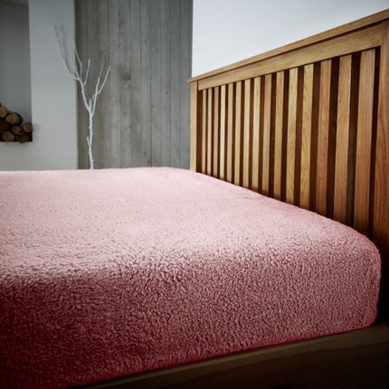 TEDDY PLAIN is a luxurious fitted sheet crafted with 100% polyester for a soft and smooth feel. Boasting a bright pink hue, this fitted sheet is perfect for adding a splash of color to any space.