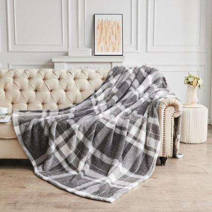 TEDDY WINDSOR CHECK throws are crafted with a luxurious and durable Teddy fleece fabric that is designed to provide long-lasting comfort. With a blend of premium synthetic materials for a sumptuously soft feel, in a stylish Grey/charcoal hue, this throw is the perfect way to stay cozy.