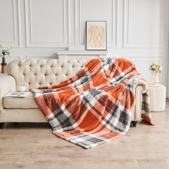 TEDDY WINDSOR CHECK is a soft and durable throw made from plush material. The fabric is a blend of high-quality man-made materials designed for comfort and longevity. Enjoy the luxurious feel of the Rust color teddy fleece throw.