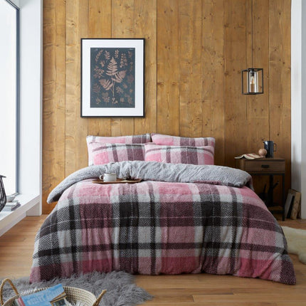 The WINDSOR CHECK Duvet Cover Set features a classic teddy check design in a charming blush pink color. Sure to elevate any bedroom, this duvet set is made from 100% Polyester for softness and comfort. Add a timeless look to your home with this stylish set.