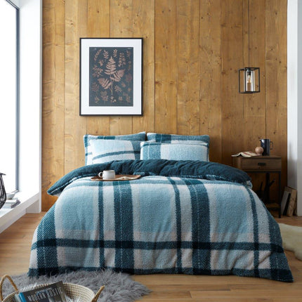 The WINDSOR CHECK teddy duvet cover set is the perfect addition to your bedroom. It is made of soft, breathable fabric and is available in a beautiful green color. The check pattern adds a stylish touch. It's a great choice for any bedroom.