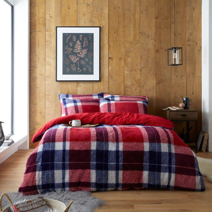 Behold the bold look of the Windsor Check Duvet Cover Set. Featuring a 100% polyester construction in a navy and red check pattern, this set is the perfect way to add a touch of classic elegance to any bedroom. The machine washable construction ensures easy maintenance.