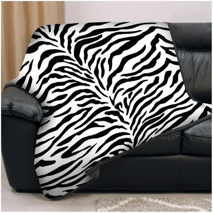 This ANIMAL SKIN throw offers superior warmth and comfort as a faux fur alternative. The hypoallergenic material is colorfast and easy to maintain. This Zebra Mono Color throw will bring a stylish, modern design to any room.