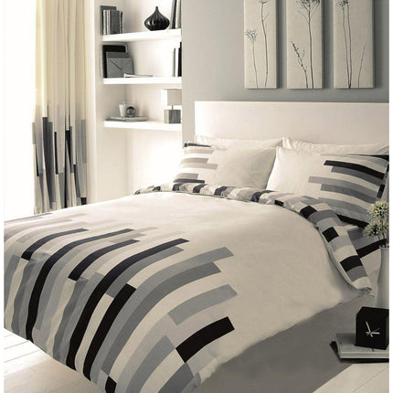 This luxurious BLOCKS Duvet Cover Set features a unique and stylish black, cream, and grey color combination. Crafted with high-quality 50% polyester and 50% cotton, this set is soft, lightweight for all-night comfort. Enjoy a warm and cozy night's sleep with this must-have bedding set.