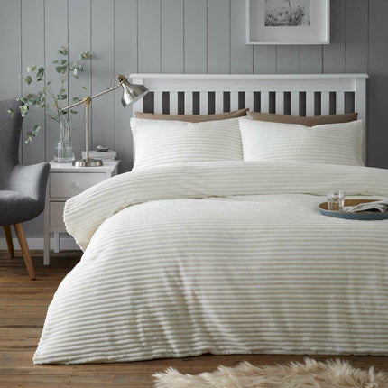 The CHUNKY RIB Teddy Duvet Cover Set is crafted with a luxuriously plush fabric designed to keep you warm and cozy. The cream colored set is perfect for a subtle yet chic look in any bedroom. Featuring a lightweight, chunky rib texture, this stylish duvet will provide you with all season comfort.